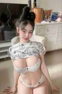 KL Escort Girl Woman in anime crop top and white lingerie kneeling indoors. Sex Call Girl