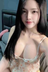 KL Escort Girl Asian woman with long black hair in a floral camisole top. Sex Call Girl