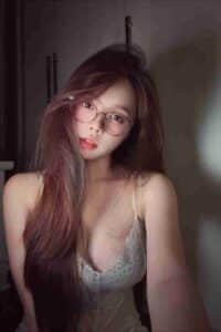 KL Escort Girl Woman with glasses and long hair wearing a lace top. Sex Call Girl