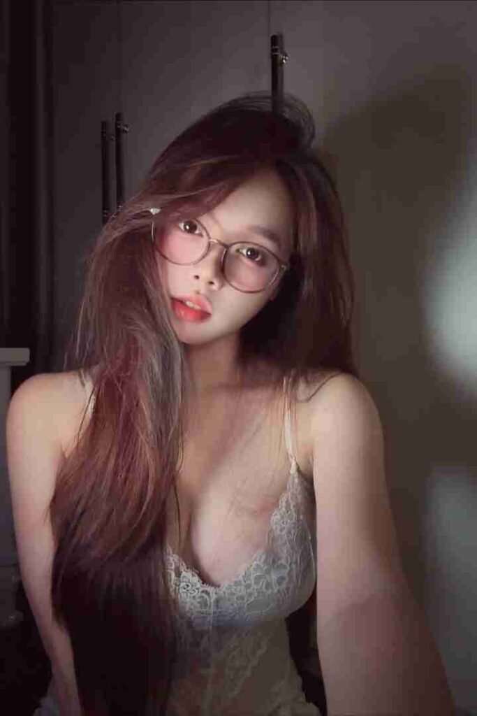 KL Escort Girl Woman with glasses and long hair wearing a lace top. Sex Call Girl