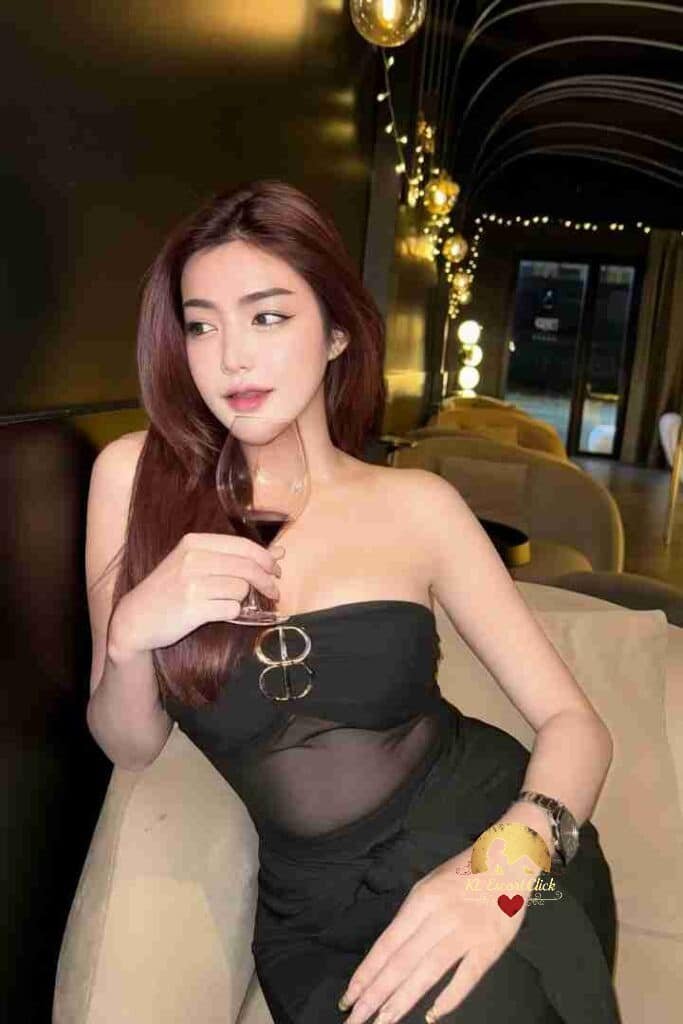 KL Escort Girl Woman in black lingerie and glasses poses in front of curtains. Sex Call Girl