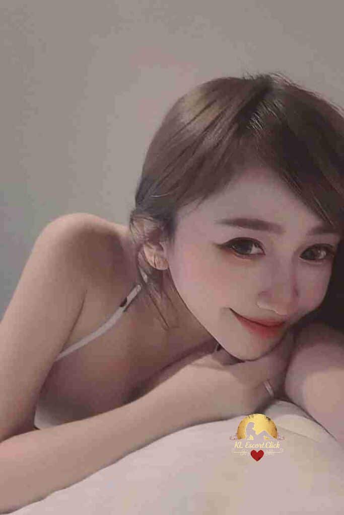 Attractive Asian woman smiling, KL escort friend portrait.