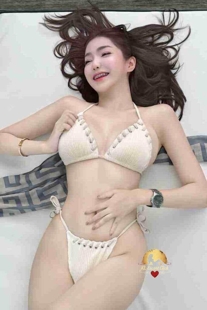 KL Escort Girl Woman in black lingerie and glasses poses in front of curtains. Sex Call Girl